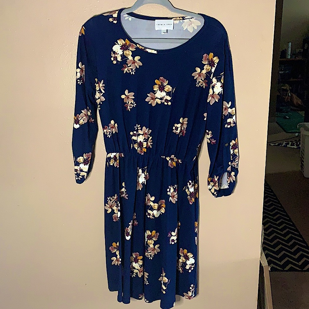 Large, navy-colored dress with flower print.